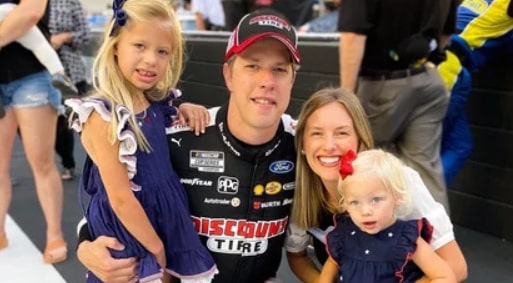 Image of Brad Keselowski and Paige White with their kids