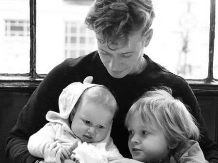 Image of Ed Speleers with his kids with Asia Macey