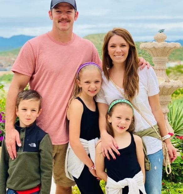 Image of Matt and Meredith Atkinson Carriker with their kids, Lincoln, Adalyn, and Annie.