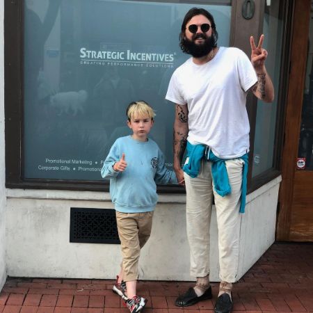 Image of Nick Thune with his son