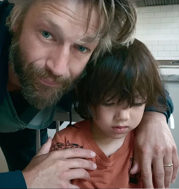  Image of Peter Scanavino with his son