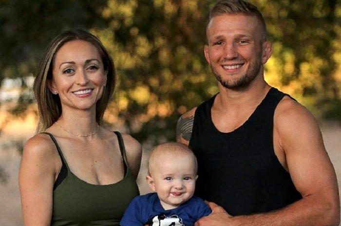  Image of T.J. and Rebecca Dillashaw with their son, Bronson
