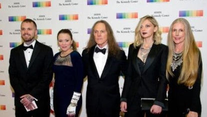 Image of Timothy B. Schmit with his wife, Jean Cromie, and their kids