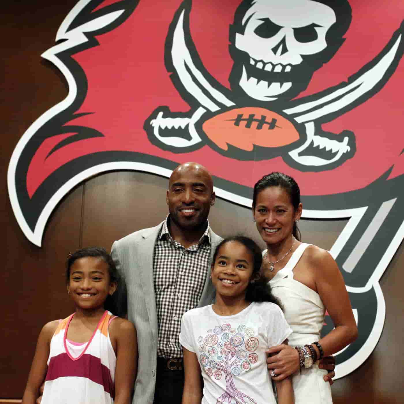 Image of the Professional Football Player and former Sports Broadcaster with his wife and kids 