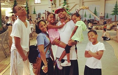 Image of Allen Iverson with his former wife, Tawanna Turner, and their kids