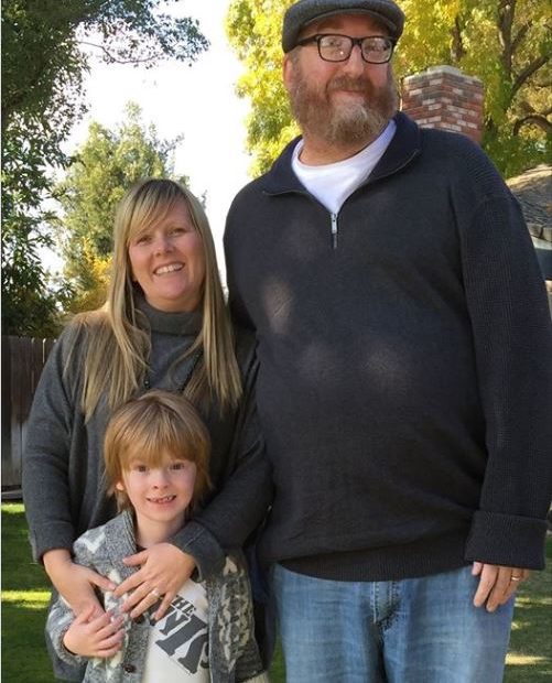Image of Brian and Melanie Posehn with their son, Rhoads Posehn