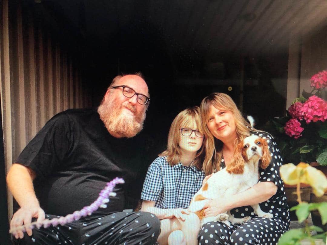 Image of Brian and Melanie Posehn with their son, Rhoads Posehn