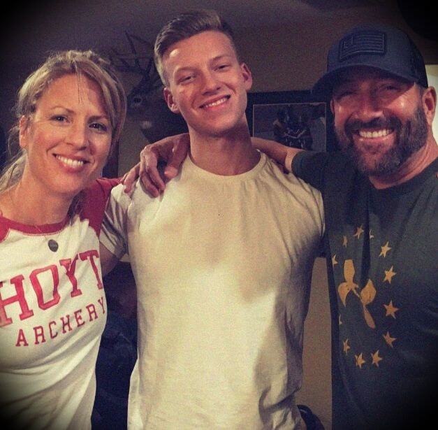 Image of Cameron Hanes with his wife, Tracey Hanes, and their son