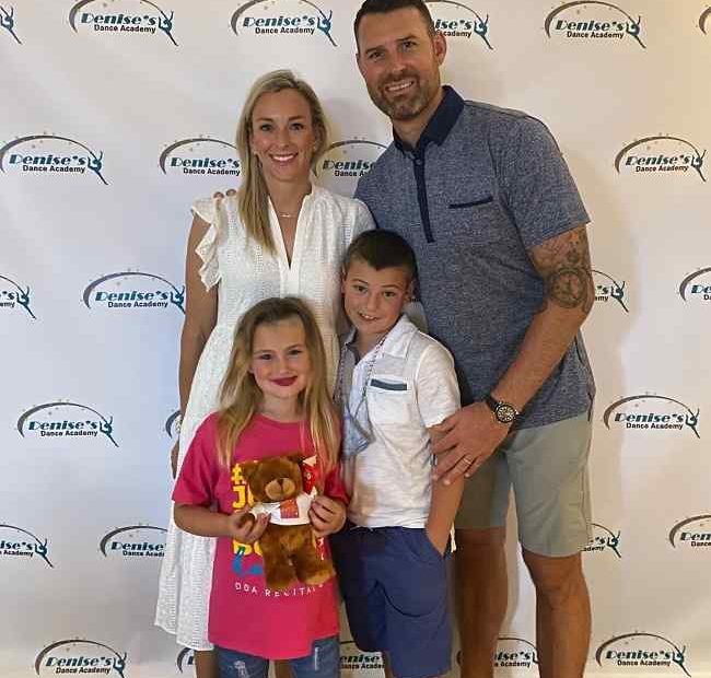 Image of Chad Henne with his wife, Brittany Hartman Henne, with their kids, Chace and Hunter Henne