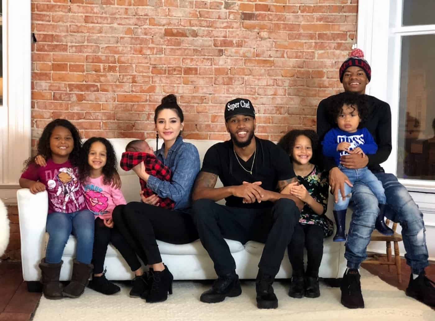 Image of Darnell Ferguson and Tatahda with their kids