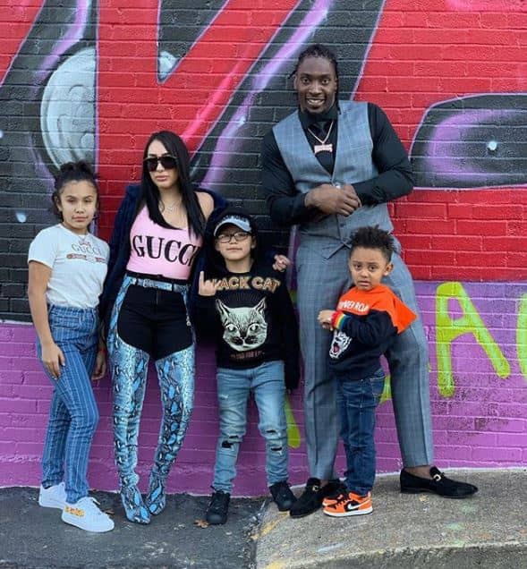 Image of DeMarcus and Sasha Lawrence with their kids, Damari, Million, and Kal-el