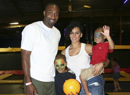 Image of Gilbert Arenas and his ex-wife, Laura Govan with their kids, Aloni, Izela, Alijah, and Hamiley