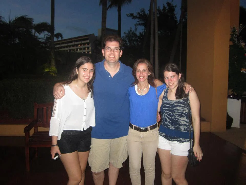Image of John and Debra Hein with their daughters Rachel and Emily 