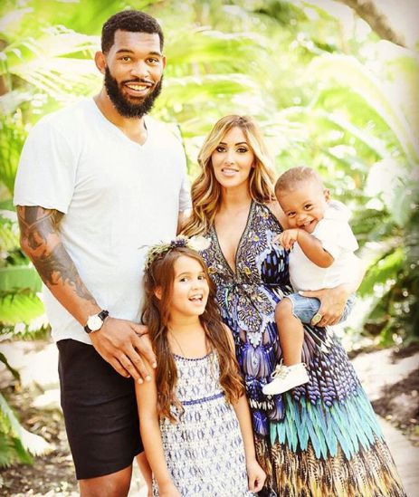Image of Julius Peppers with his girlfriend, Claudia Sampedro, and their kids