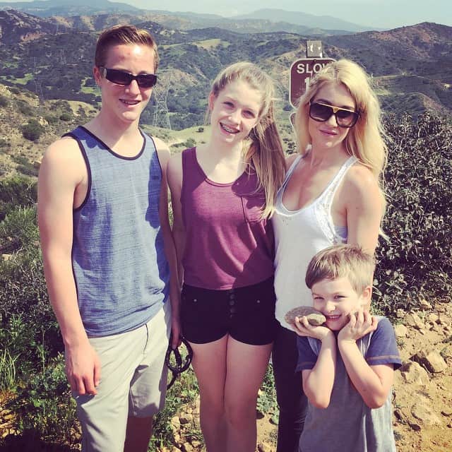 Image of Rebecca Bisping with her kids, Lucas, Callum, and Ellie.