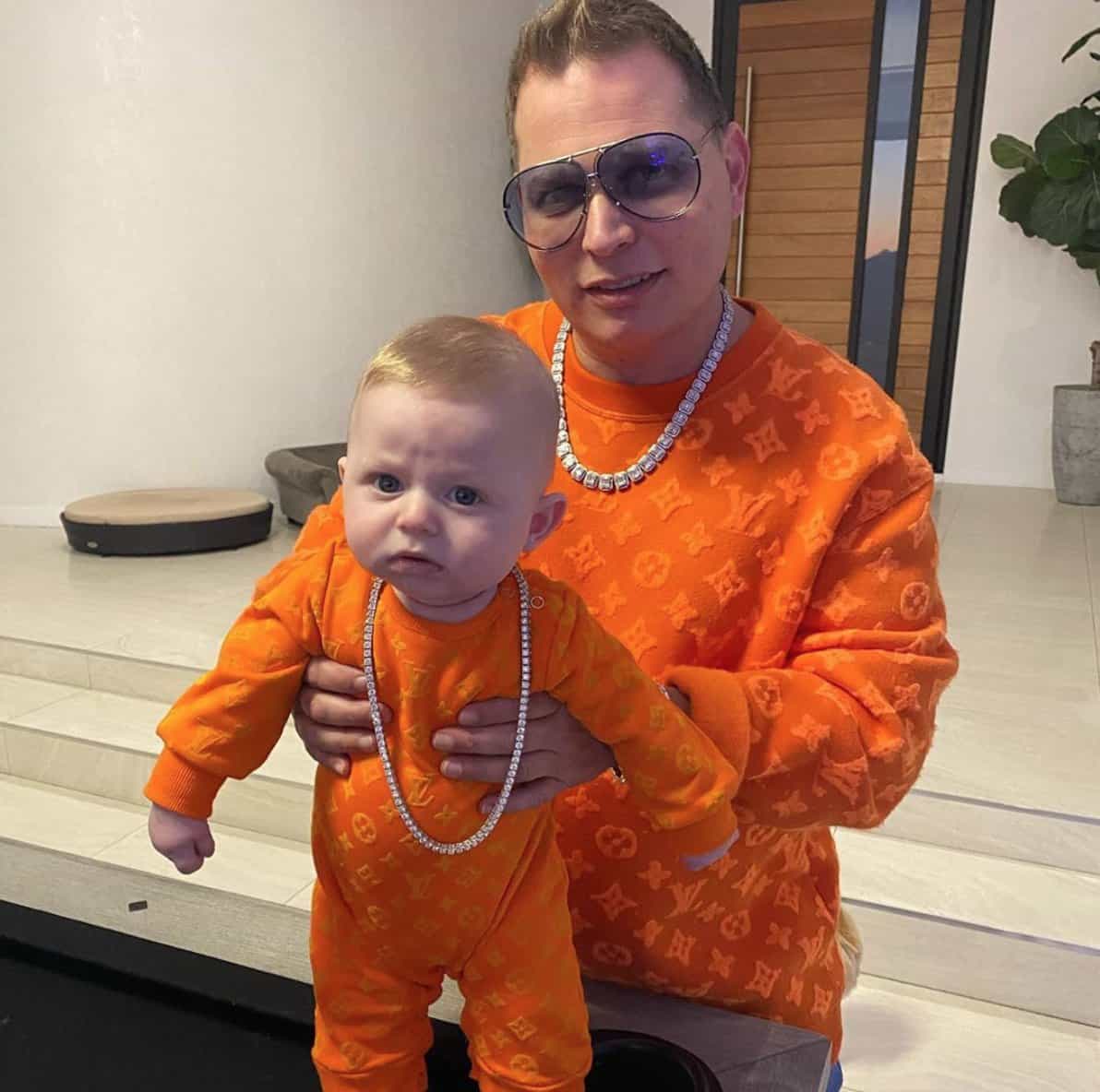 Image of Record Producer with one of his kids 