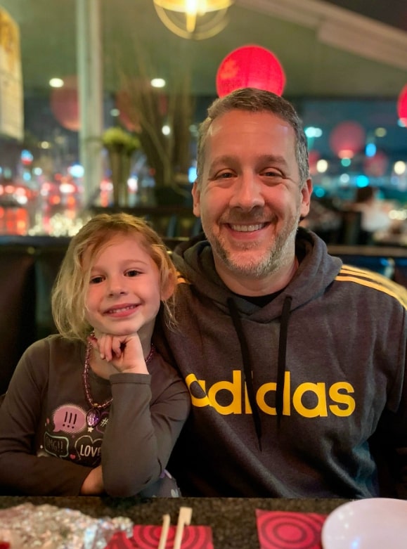 Image of Ryan Sickler with his daughter