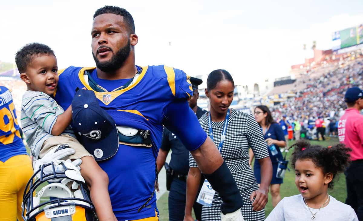 Image of Aaron Donald with his wife, Erica Donald, and their kids