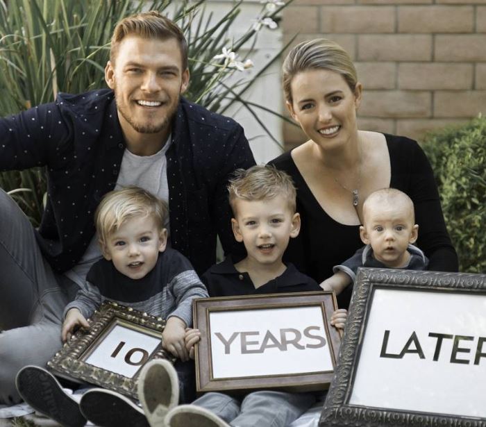 Image of Alan Ritchson with his wife, Catherine Ritchson, and their kids
