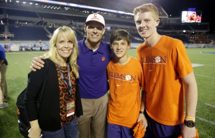 Image of Brent Venables with his wife, Julie Venables, and their sons, Jake and Tyler