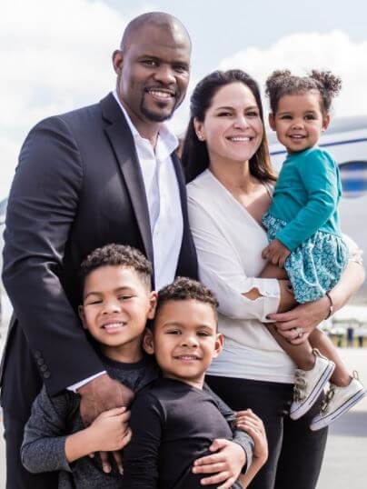 Image of Brian Flores with his wife, Maria Duncan Flores, and their kids