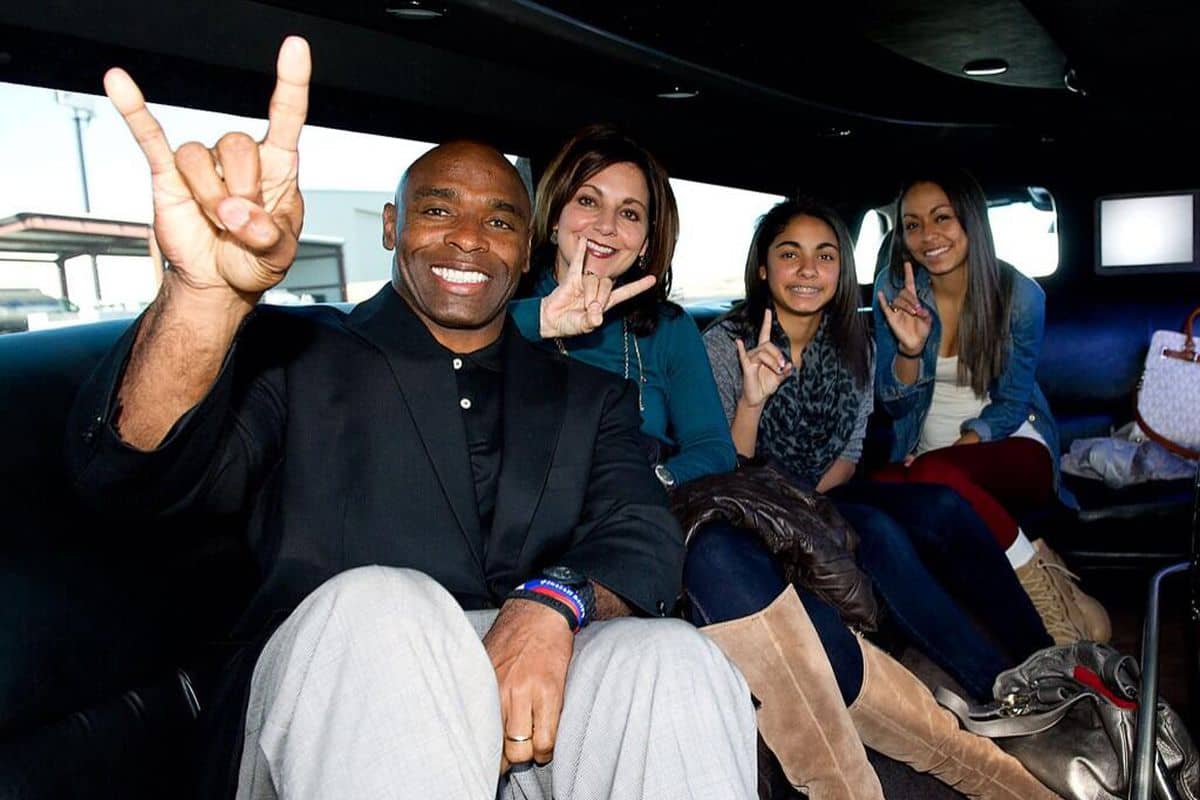 Image of Charlie Strong with his wife, Victoria Strong, and their daughters
