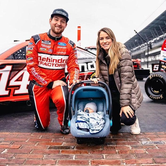 Image of Chase Briscoe with his wife, Marissa Briscoe, and their son, Brooks Wayne Cunningham