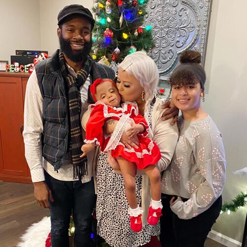 Image of DC Young Fly with his partner, Jacky Oh, and their kids