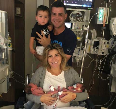 Image of Gary Woodland with his wife, Gabby Granado, and their kids