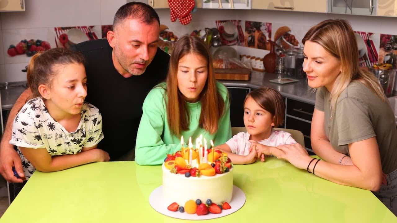 Image of Georgy Kavkaz with his wife, Alesia, with their kids