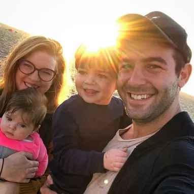 Image of James Wolk with his wife, Elizabeth Jae Byrd, and their kids