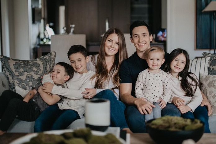 Image of Jared Spurgeon with his wife, Danielle Spurgeon, and their kids
