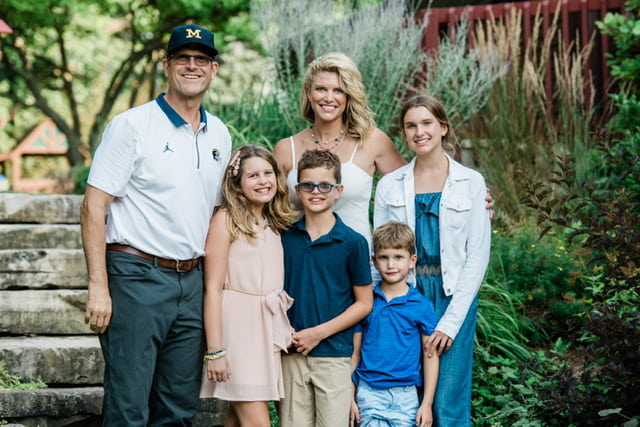 Image of Jim Harbaugh with his wife, Sarah Feuerborn Harbaugh, and their kids