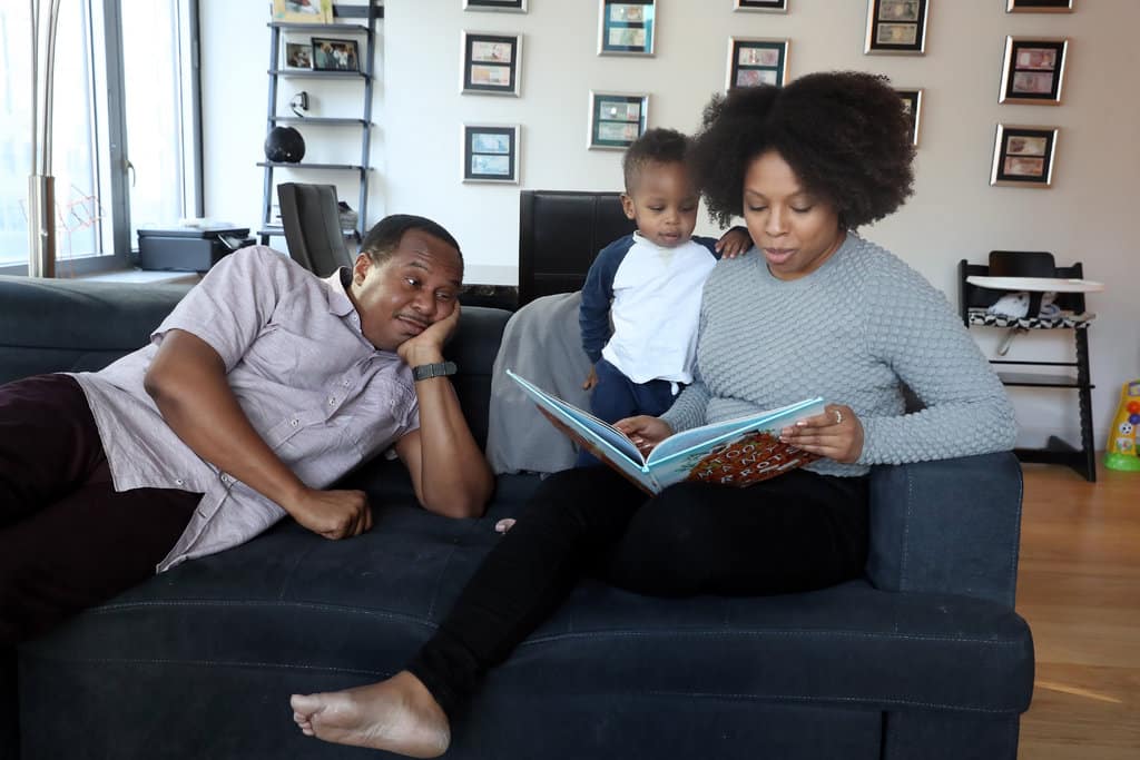Image of Roy Wood Jr. with his partner, Salone Monet, and their son, Harry Wood