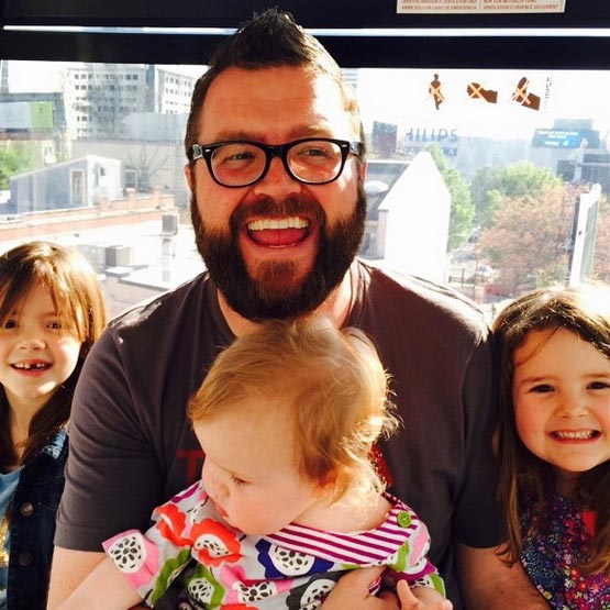 Image of Rutledge Wood with his daughters, Elsie, Millie, and Hattie Wood