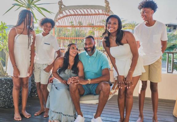 Image of Tracy McGrady with his wife, CleRenda McGrady, and their kids