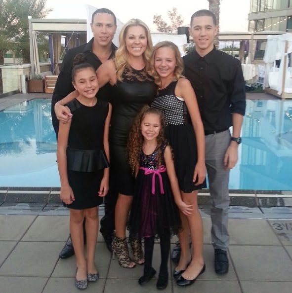 Image of Mike Bibby with his wife, Darcy Watkins, and their kids