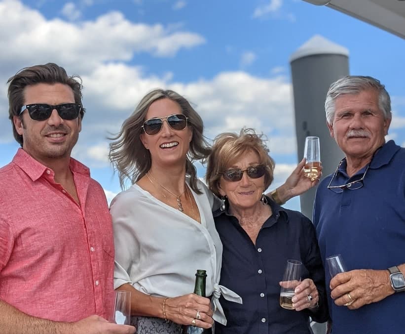 Image of Tom Silva with his wife, Susan Silva, and their daughter, Kate, and her husband